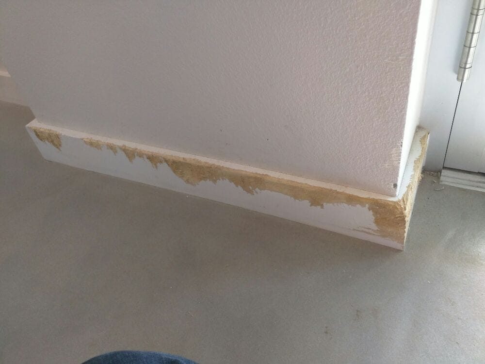 Baseboard trim before the repair