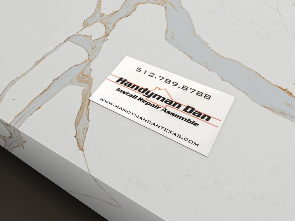 Handyman Dan business card on a marble countertop
