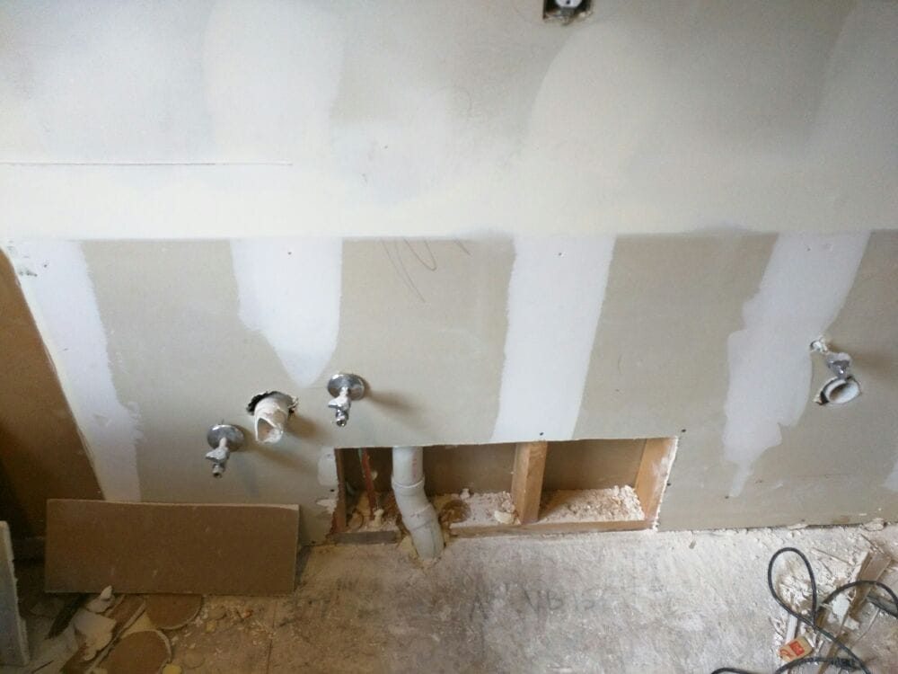 Wall opened up for plumbing repair