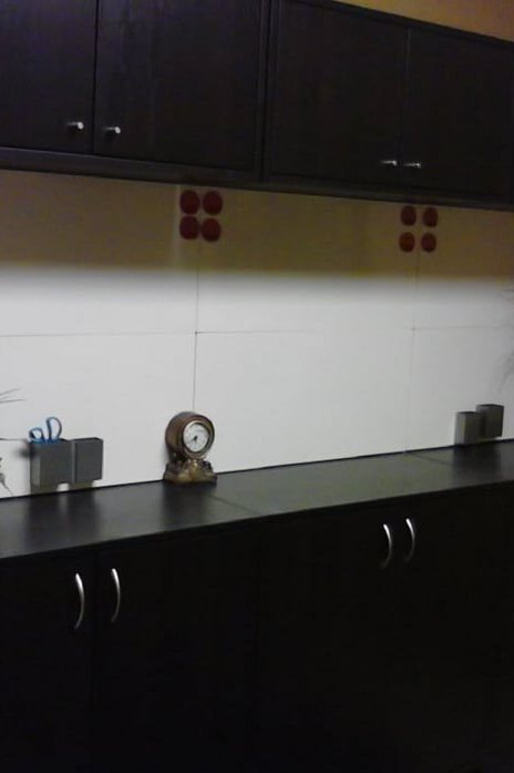 Dark IKEA cabinets assembled and installed along a wall