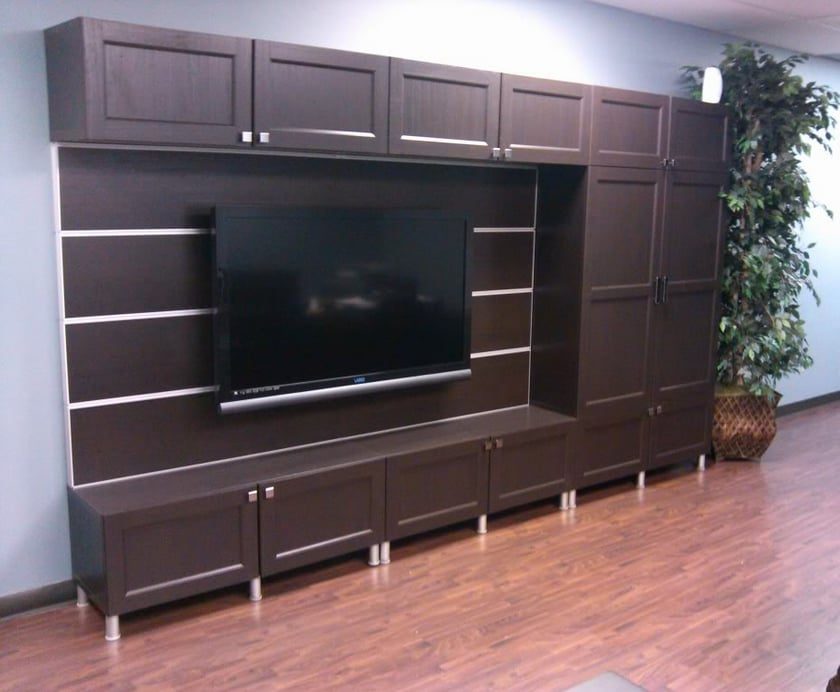 IKEA wall unit with a television mounted in the middle